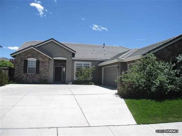 10460 Silver Rush Court Reno, NV 89521 - Photo 1 of 1 a front view of a house with a garden