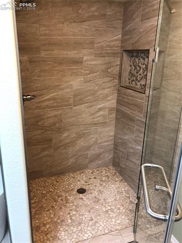 7825 Morning Dew Road Colorado Springs, CO 80908 - Photo 19 of 19 Custom tile work and shower door