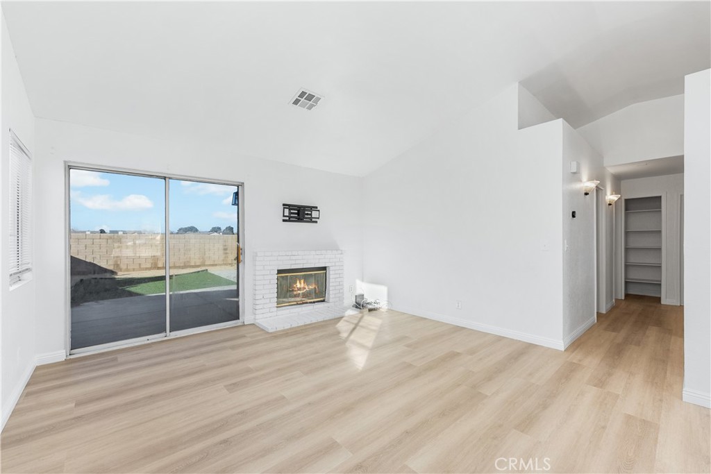 3209 Titcher Lane Rosamond, CA 93560 - Photo 13 of 36 a view of empty room with wooden floor