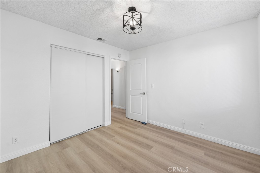 3209 Titcher Lane Rosamond, CA 93560 - Photo 20 of 36 a view of a room with wooden floor