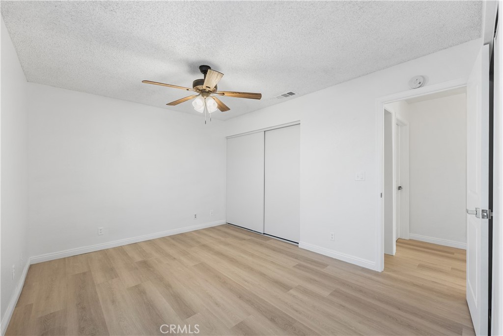 3209 Titcher Lane Rosamond, CA 93560 - Photo 26 of 36 a view of an empty room with a fan