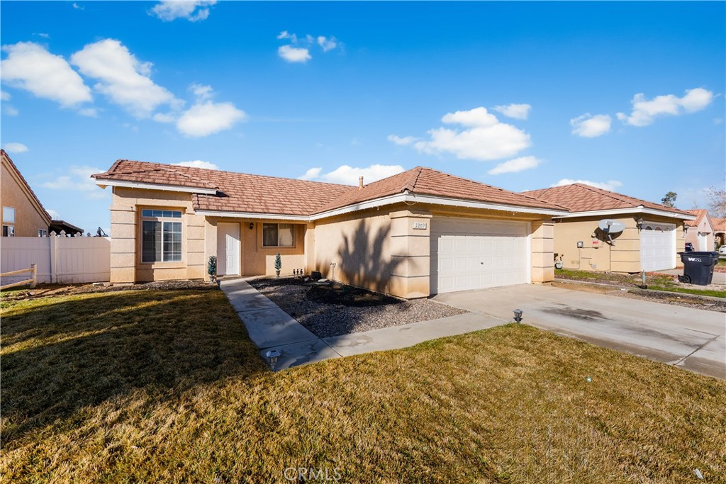 3209 Titcher Lane Rosamond, CA 93560 - Photo 36 of 36 a front view of a house with garden