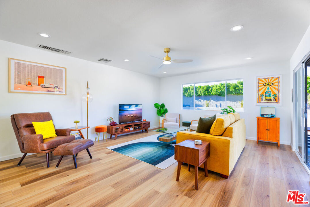 1250 East Delgado Road Palm Springs, CA 92262 - Photo 12 of 30 a living room with furniture and a wooden floor