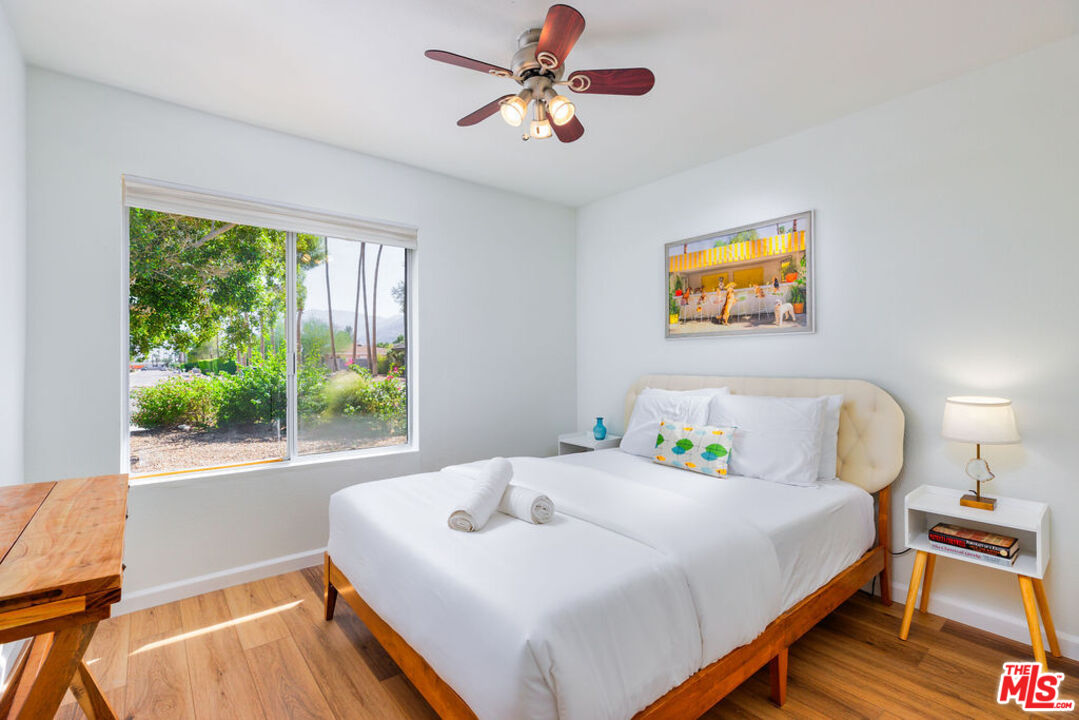 1250 East Delgado Road Palm Springs, CA 92262 - Photo 13 of 30 a bedroom with a bed and a window