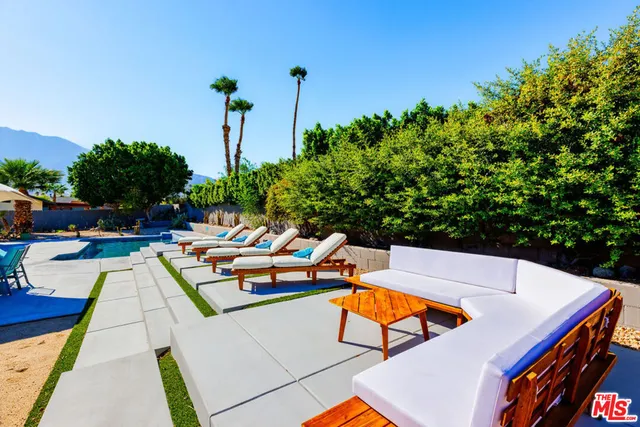a view of a patio with chairs and tables