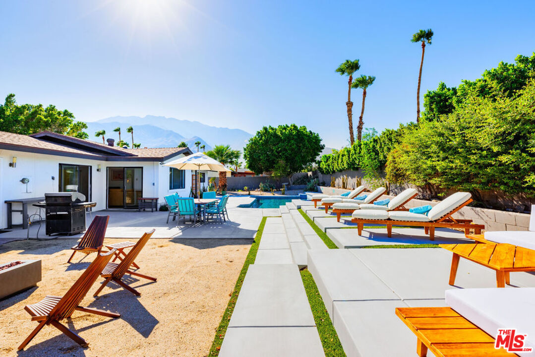 1250 East Delgado Road Palm Springs, CA 92262 - Photo 22 of 30 a view of swimming pool with outdoor seating and patio