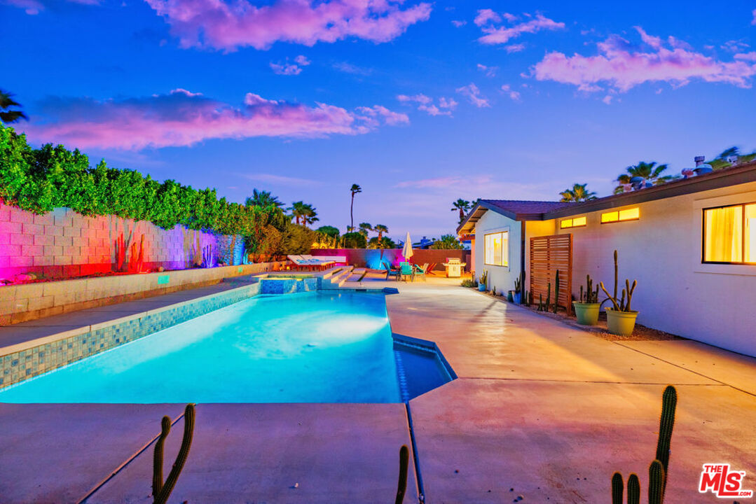 1250 East Delgado Road Palm Springs, CA 92262 - Photo 4 of 30 a view of a swimming pool with an outdoor seating