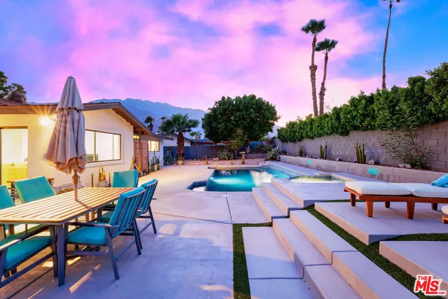 a outdoor space with furniture a window and a chandelier