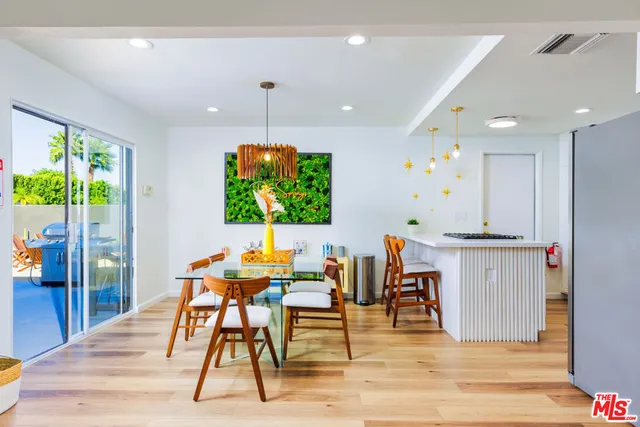 a kitchen with stainless steel appliances kitchen island a stove and a refrigerator