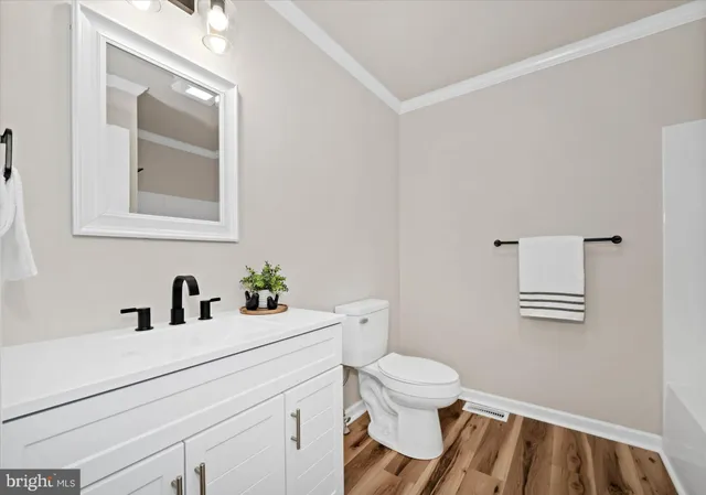 an aerial view of a house with a yard and lake view