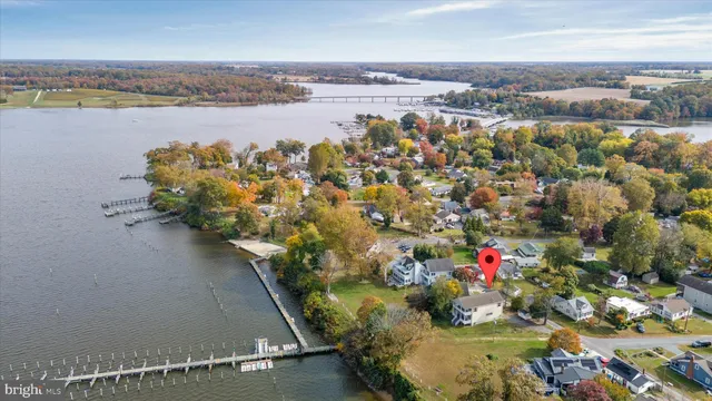 an aerial view of residential house with pool and yard