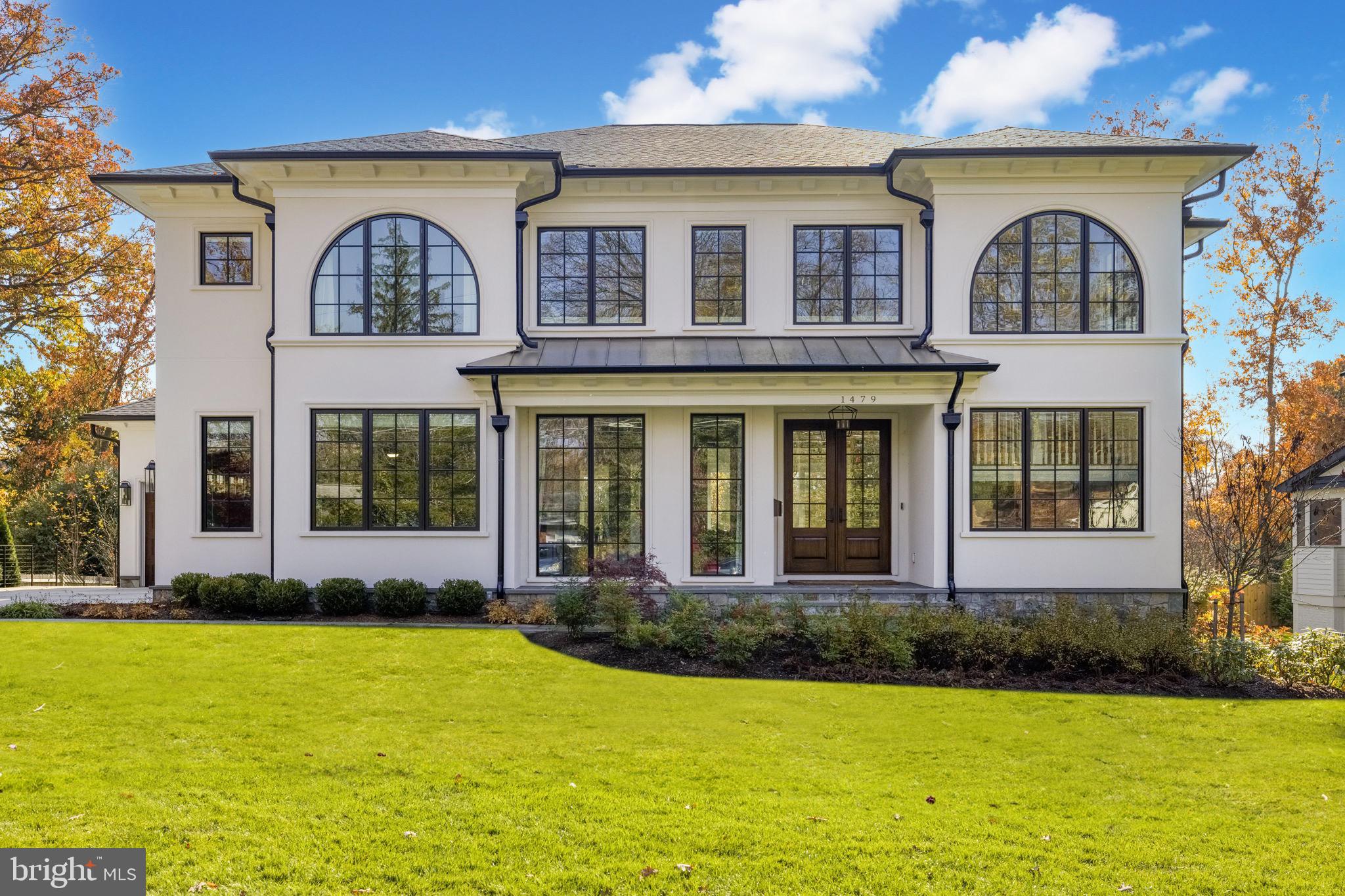 a front view of a house with lots of swimming pool