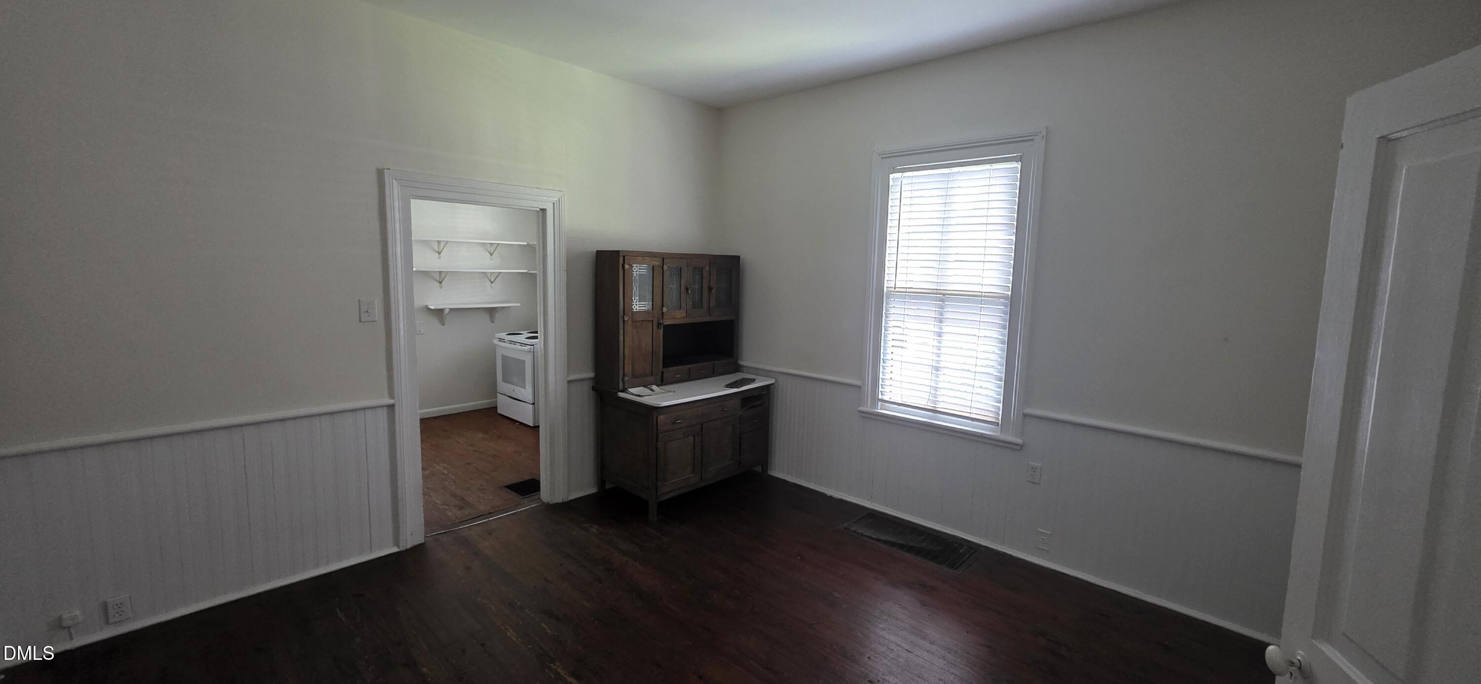 509 North East Street Raleigh, NC 27604 - Photo 12 of 18 a kitchen with a refrigerator and wooden floor