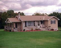 698 English Road Bath, PA 18014 - Photo 1 of 1 a front view of a house with a garden and trees