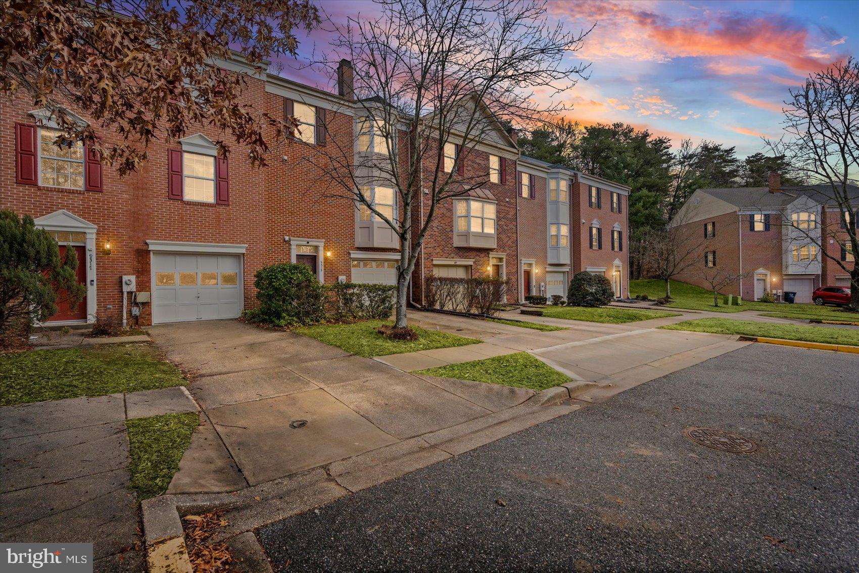 a pathway of a house with a yard