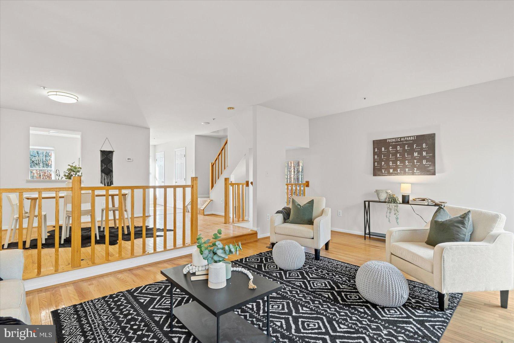 9317 Dortmund Court Laurel, MD 20708 - Photo 20 of 50 a living room with furniture and a table