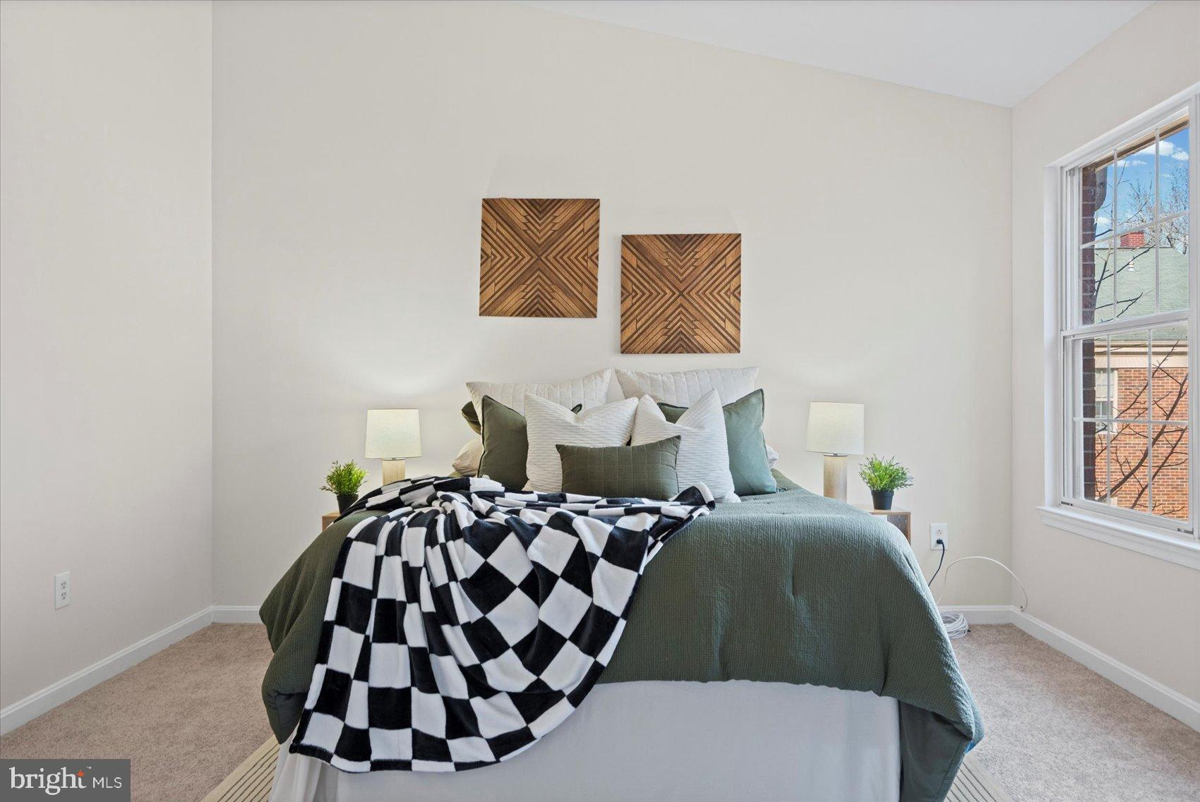 9317 Dortmund Court Laurel, MD 20708 - Photo 24 of 50 a bedroom with a bed and painting on the wall