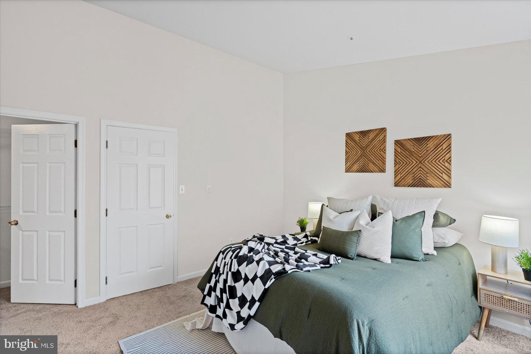 9317 Dortmund Court Laurel, MD 20708 - Photo 25 of 50 a bedroom with a bed and painting on the wall