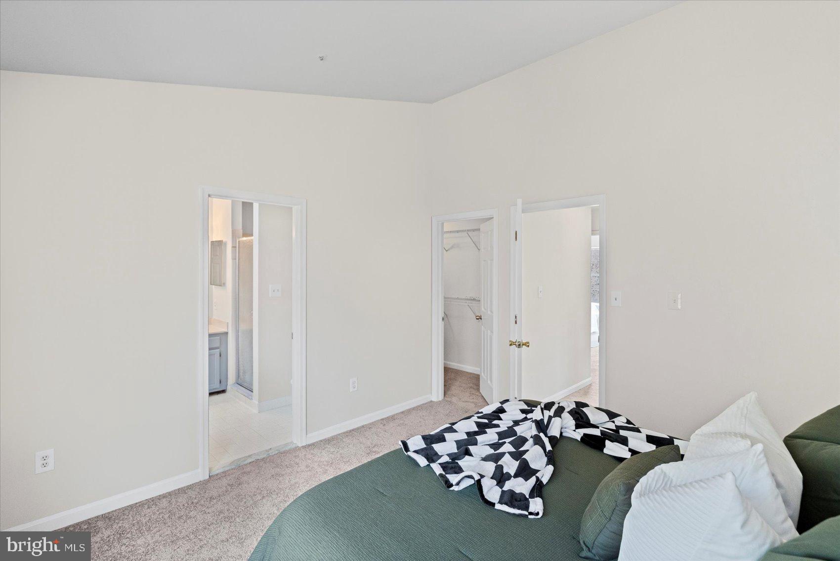 9317 Dortmund Court Laurel, MD 20708 - Photo 26 of 50 a bedroom with a bed and a window