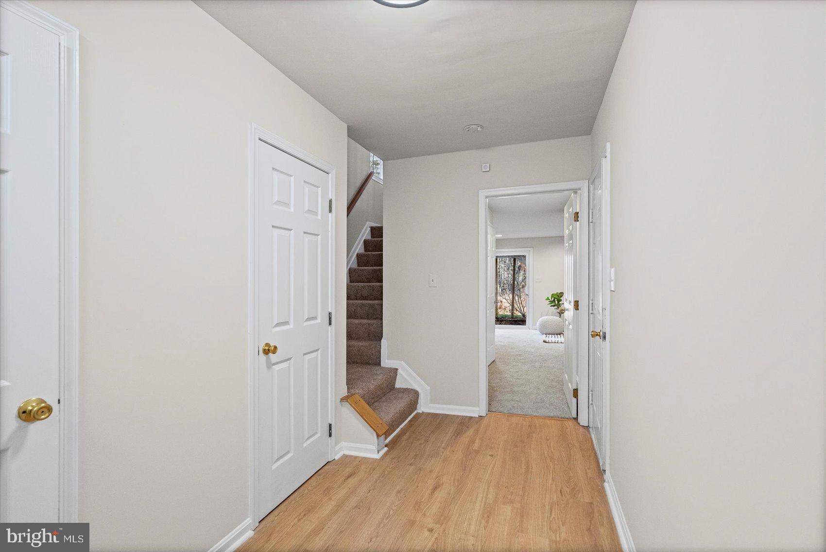 9317 Dortmund Court Laurel, MD 20708 - Photo 36 of 50 a view of a bedroom from a hallway