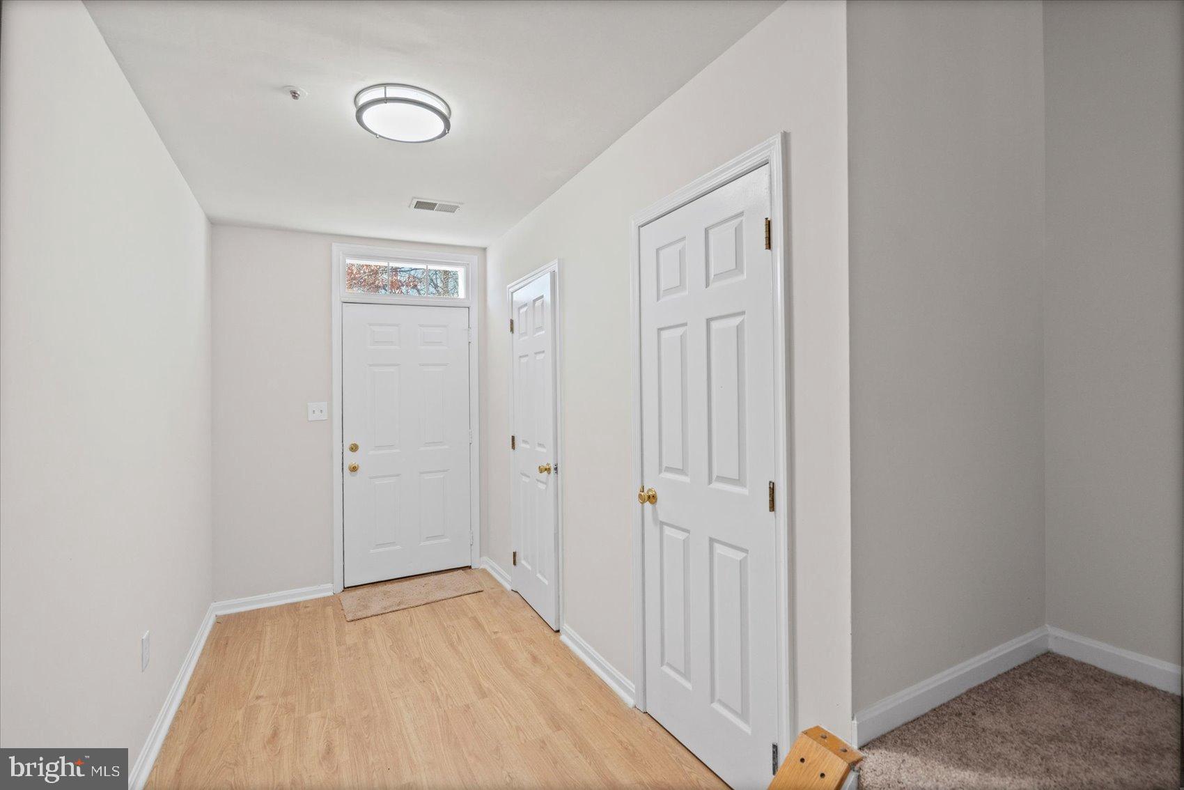 9317 Dortmund Court Laurel, MD 20708 - Photo 37 of 50 a view of a hallway to a bedroom