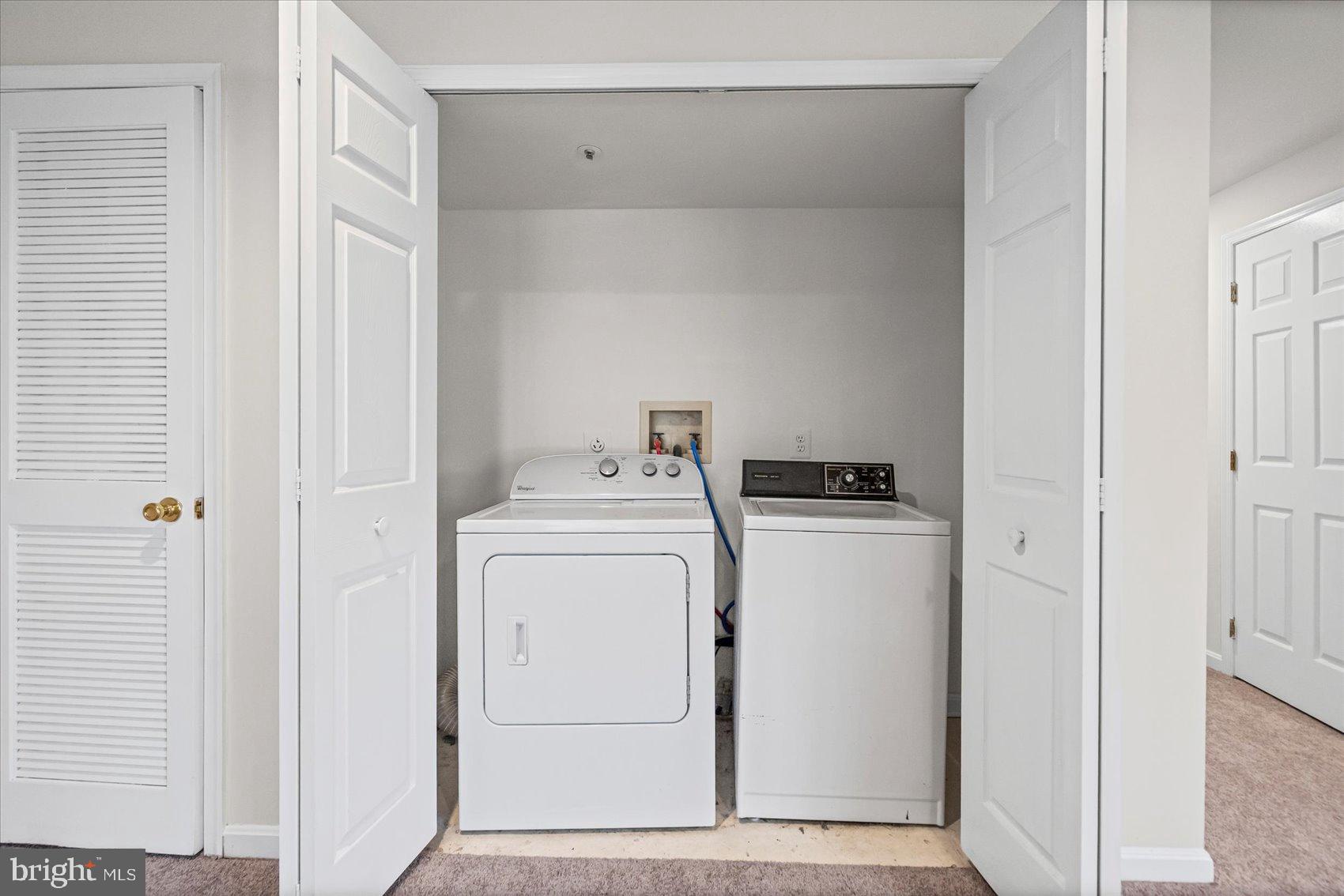 9317 Dortmund Court Laurel, MD 20708 - Photo 41 of 50 a utility room with dryer and washer