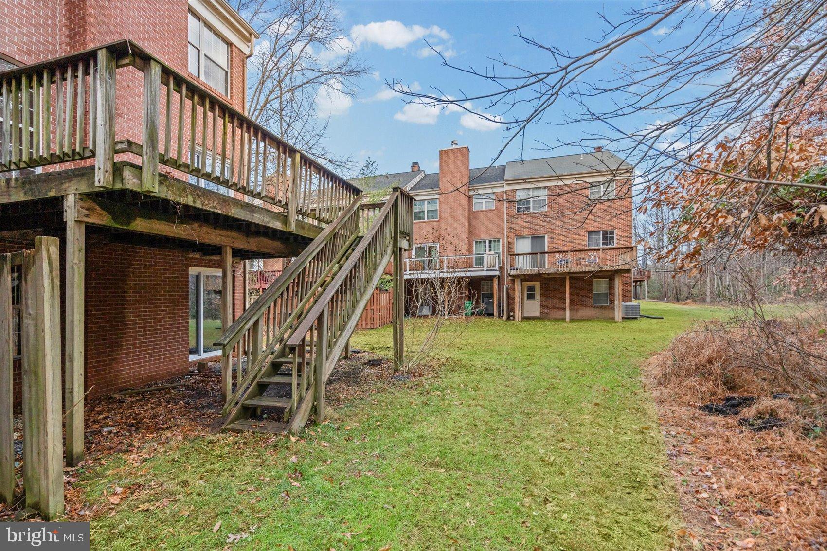 9317 Dortmund Court Laurel, MD 20708 - Photo 45 of 50 a view of a chairs with a table in the patio