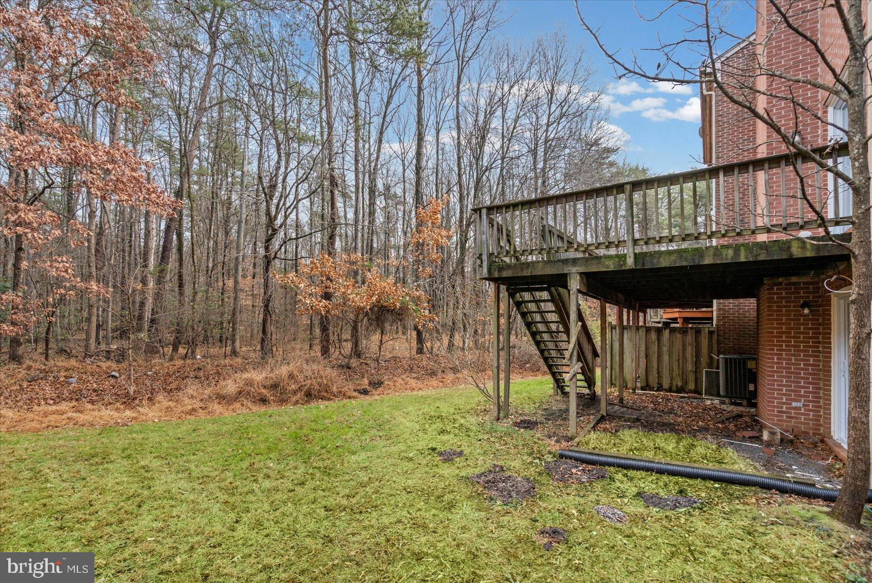 9317 Dortmund Court Laurel, MD 20708 - Photo 48 of 50 a view of a chair and table in the backyard