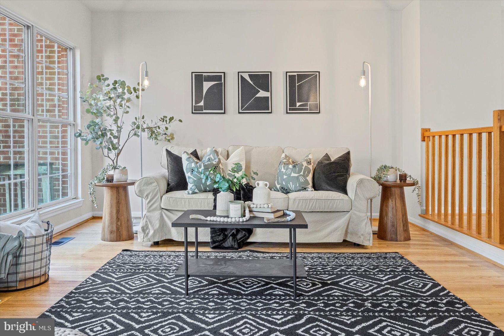 9317 Dortmund Court Laurel, MD 20708 - Photo 7 of 50 a living room with furniture and a rug