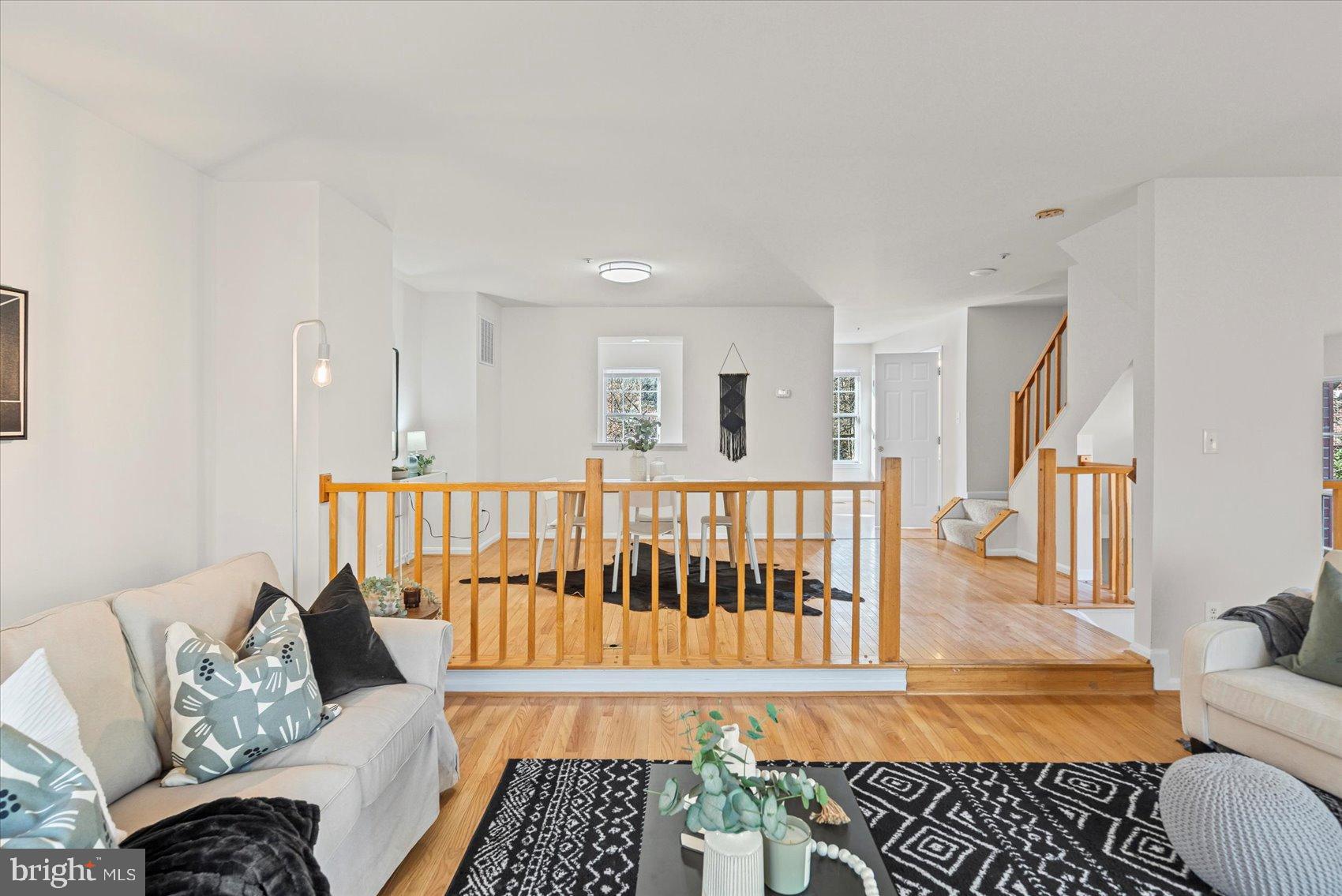 9317 Dortmund Court Laurel, MD 20708 - Photo 9 of 50 a living room with furniture and a rug