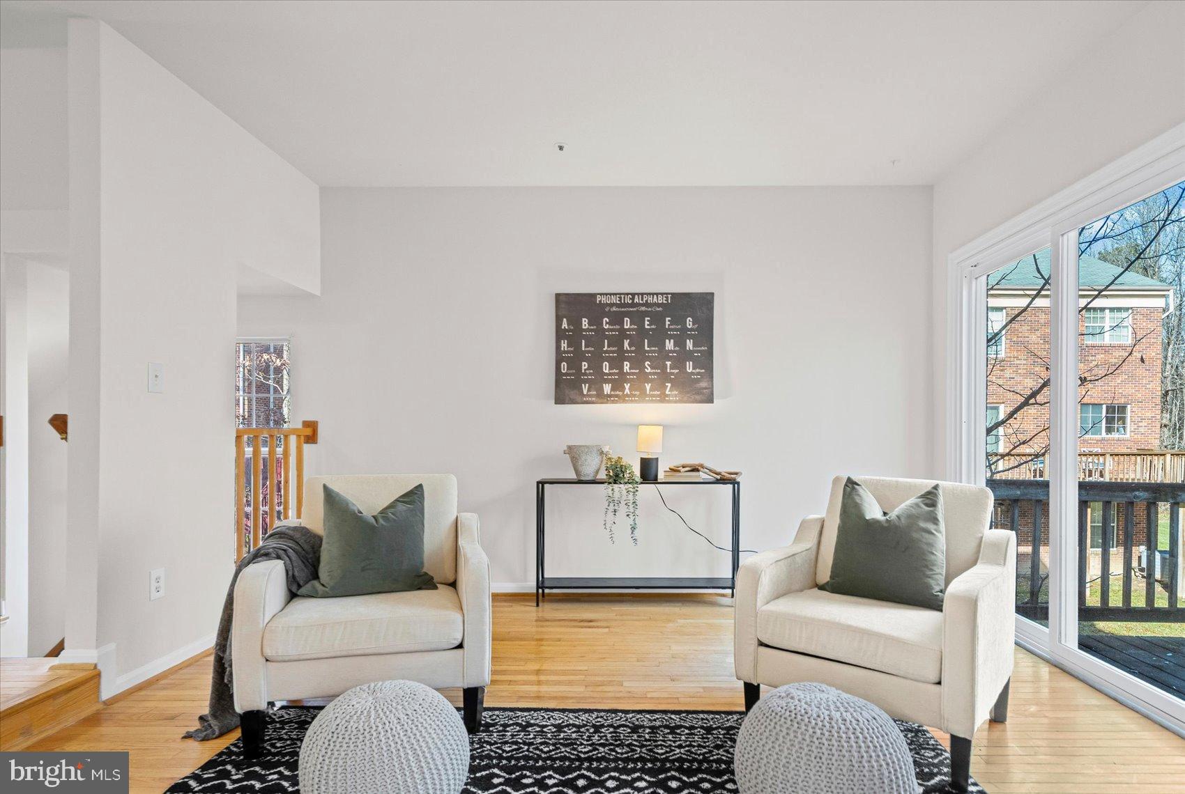 9317 Dortmund Court Laurel, MD 20708 - Photo 10 of 50 a living room with furniture a rug and a window
