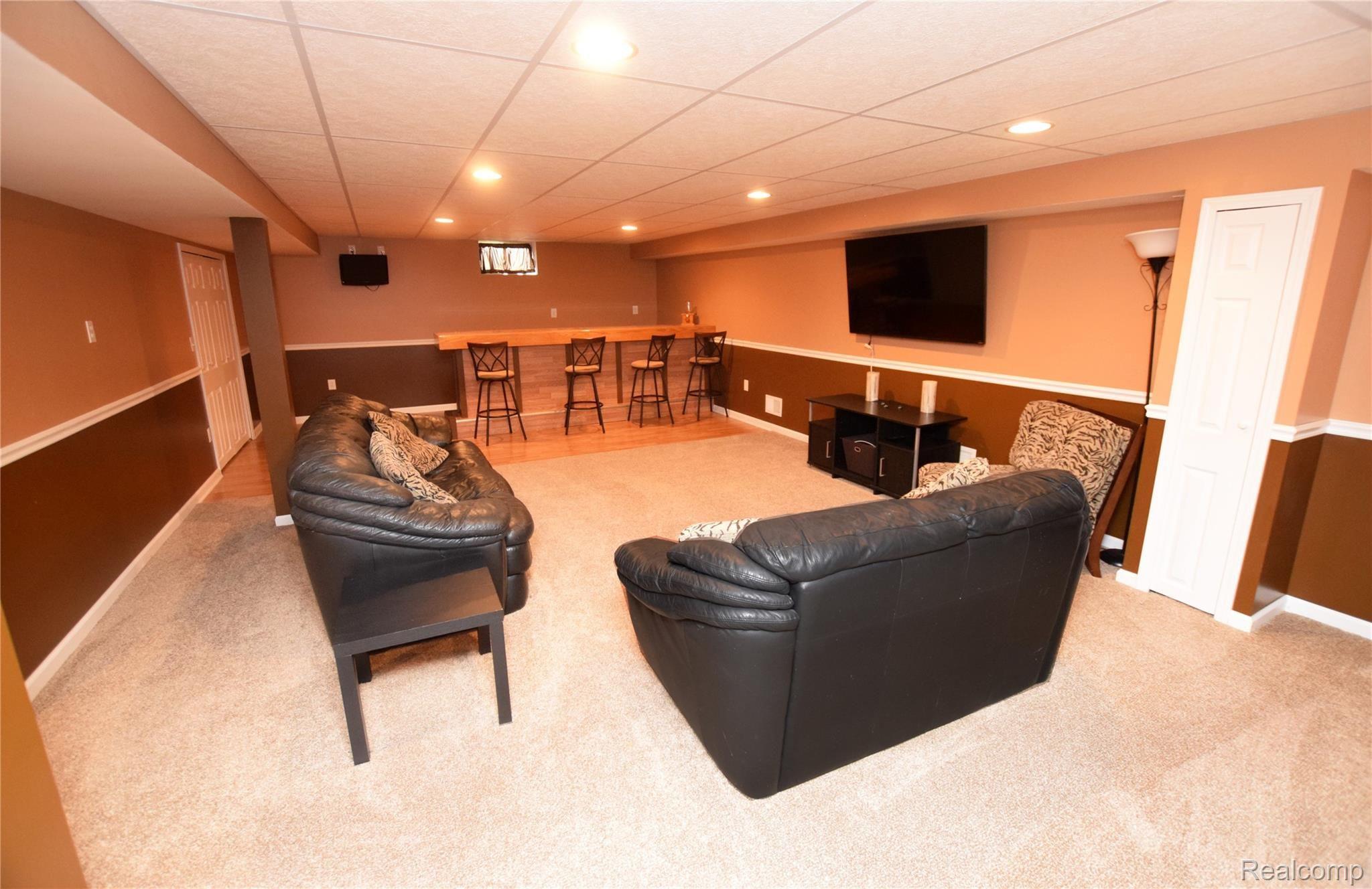 8396 Sharp Road Swartz Creek, MI 48473 - Photo 12 of 20 Lower Level Family Area with Wet Bar.JPG