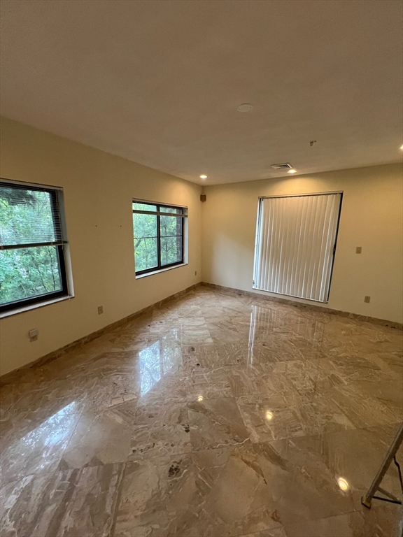 373 Highland Avenue, Unit 308 Somerville, MA 02144 - Photo 3 of 9 an empty room with windows