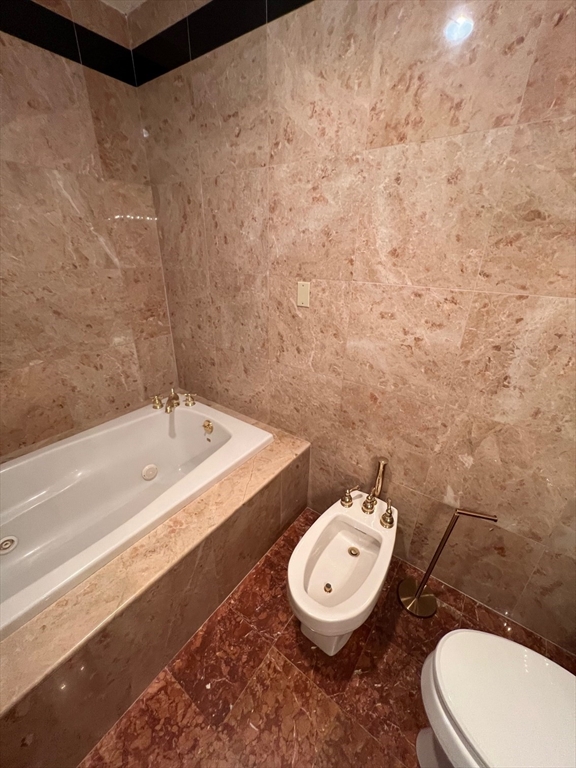 373 Highland Avenue, Unit 308 Somerville, MA 02144 - Photo 4 of 9 a bathroom with a toilet and a sink