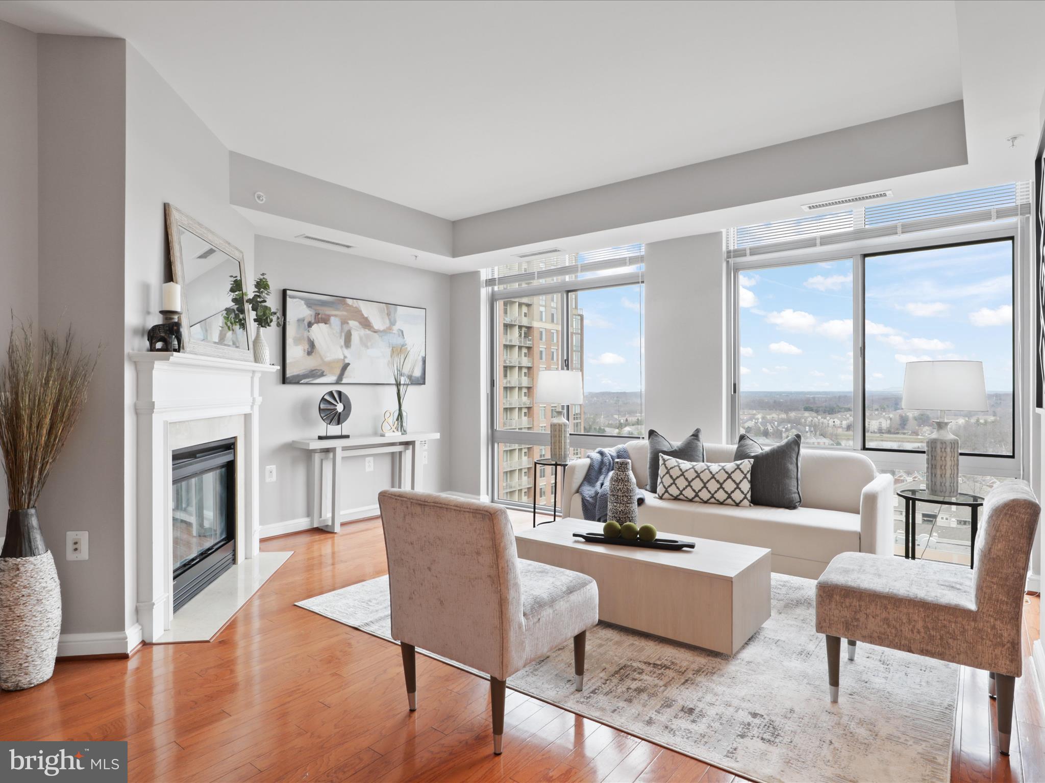11990 Market Street, Unit 1406 Reston, VA 20190 - Photo 1 of 38 living room with floor to ceiling windows and f/p
