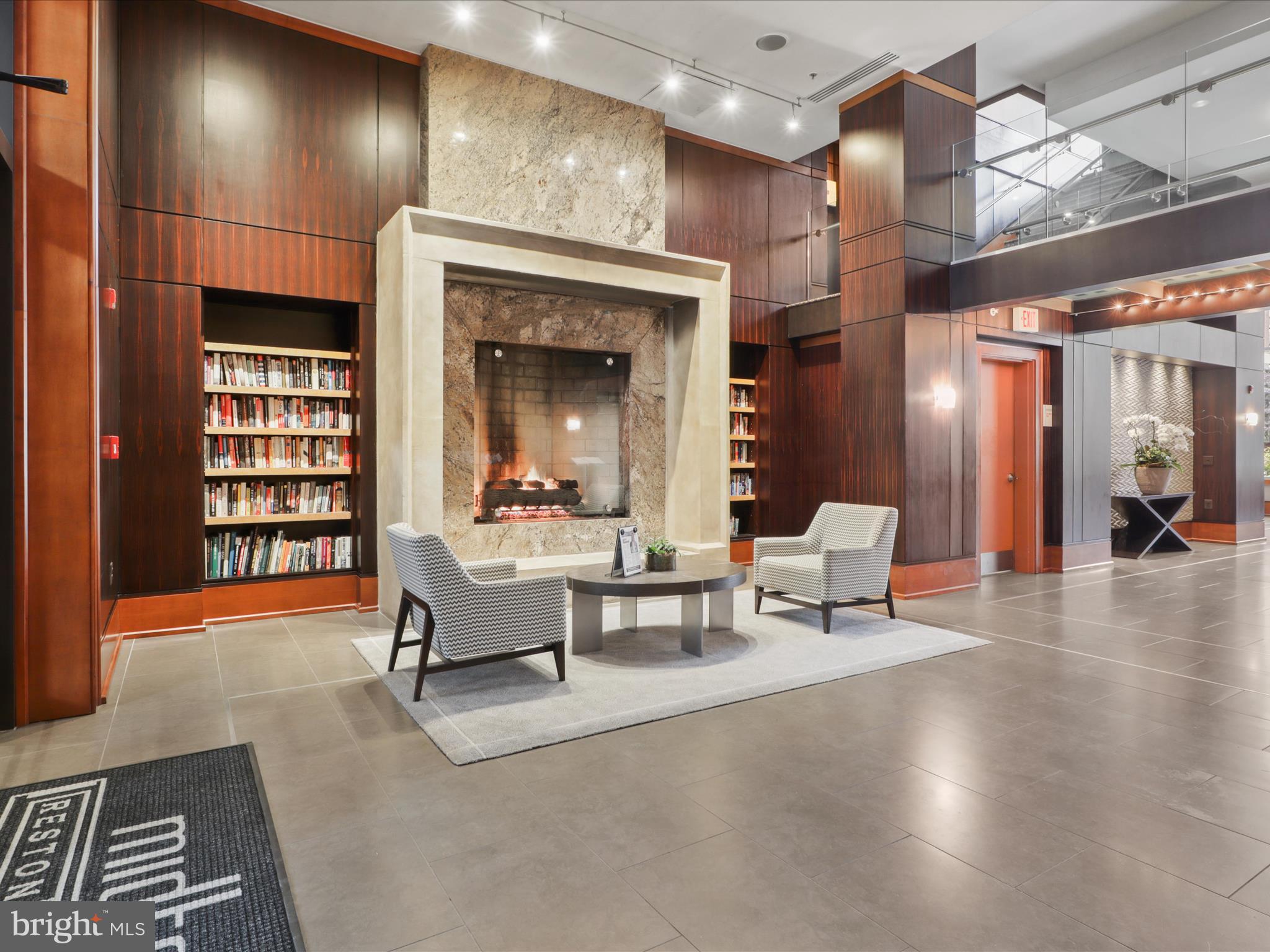 11990 Market Street, Unit 1406 Reston, VA 20190 - Photo 20 of 38 Lobby fireplace