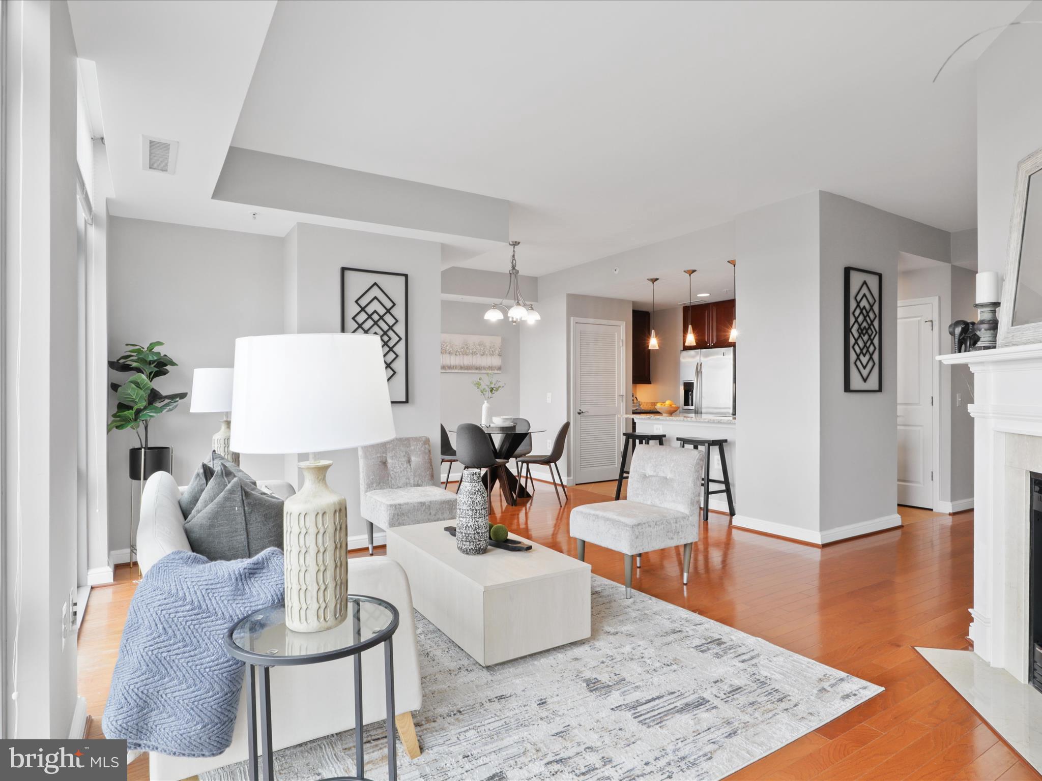 11990 Market Street, Unit 1406 Reston, VA 20190 - Photo 4 of 38 View from living room into kitchen and dining