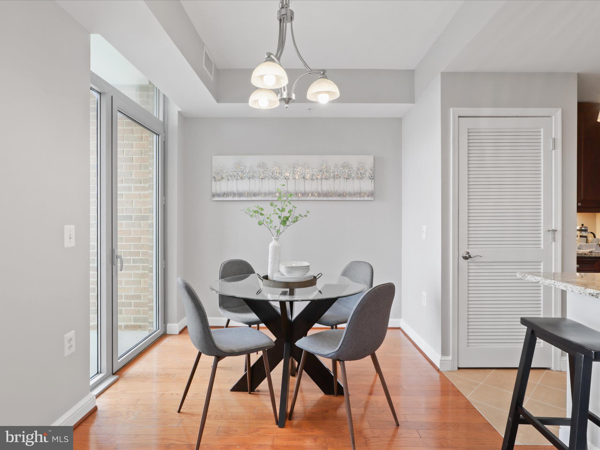11990 Market Street, Unit 1406 Reston, VA 20190 - Photo 5 of 38 Dining space with balcony