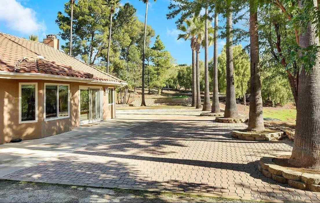 14525 Millards Ranch Lane Poway, CA 92064 - Photo 27 of 29 a view of a house with a garden and pathway