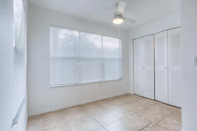 an empty room with a empty space and windows