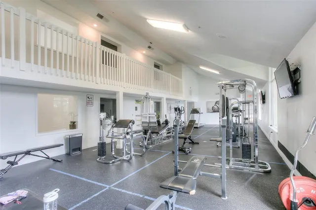 a room with lots of gym equipment