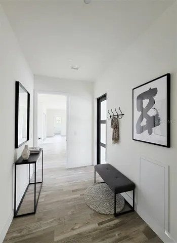 a view of a livingroom with furniture and wooden floor
