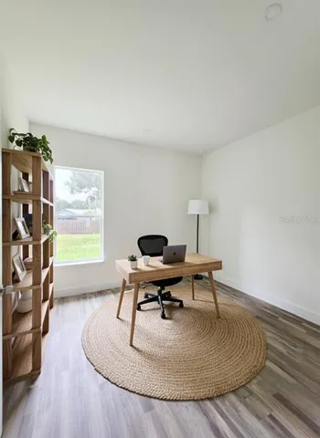 a workspace with furniture and window