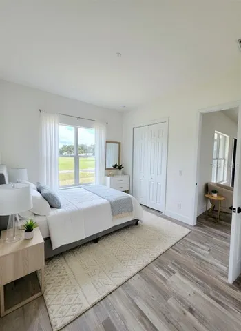 a bedroom with a bed and a couch