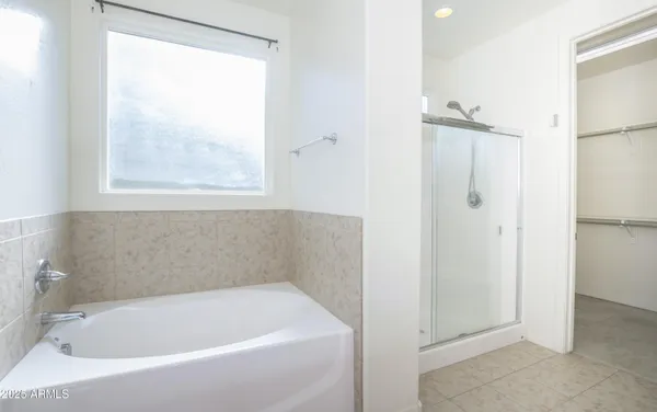a white bath tub sitting next to a window