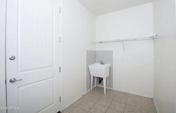 a view of a room with rack on the wall