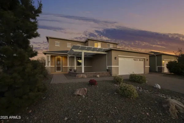 a front view of a house with yard