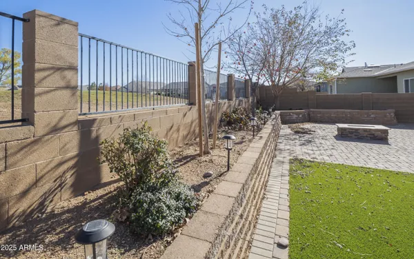 a view of a backyard with sitting area
