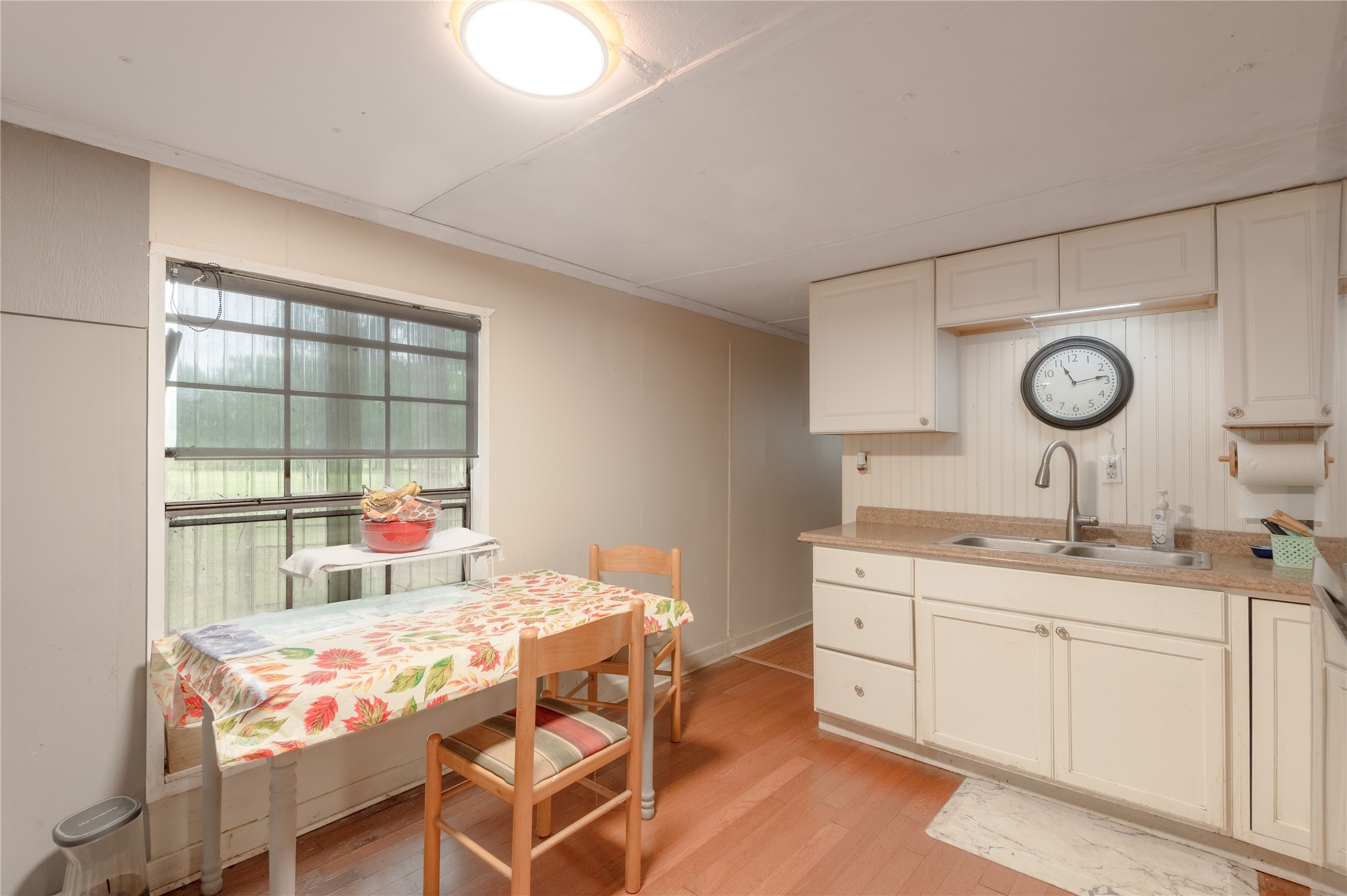 159 Pecan Avenue Groveton, TX 75845 - Photo 8 of 27 a kitchen with a stove a table and chairs in it
