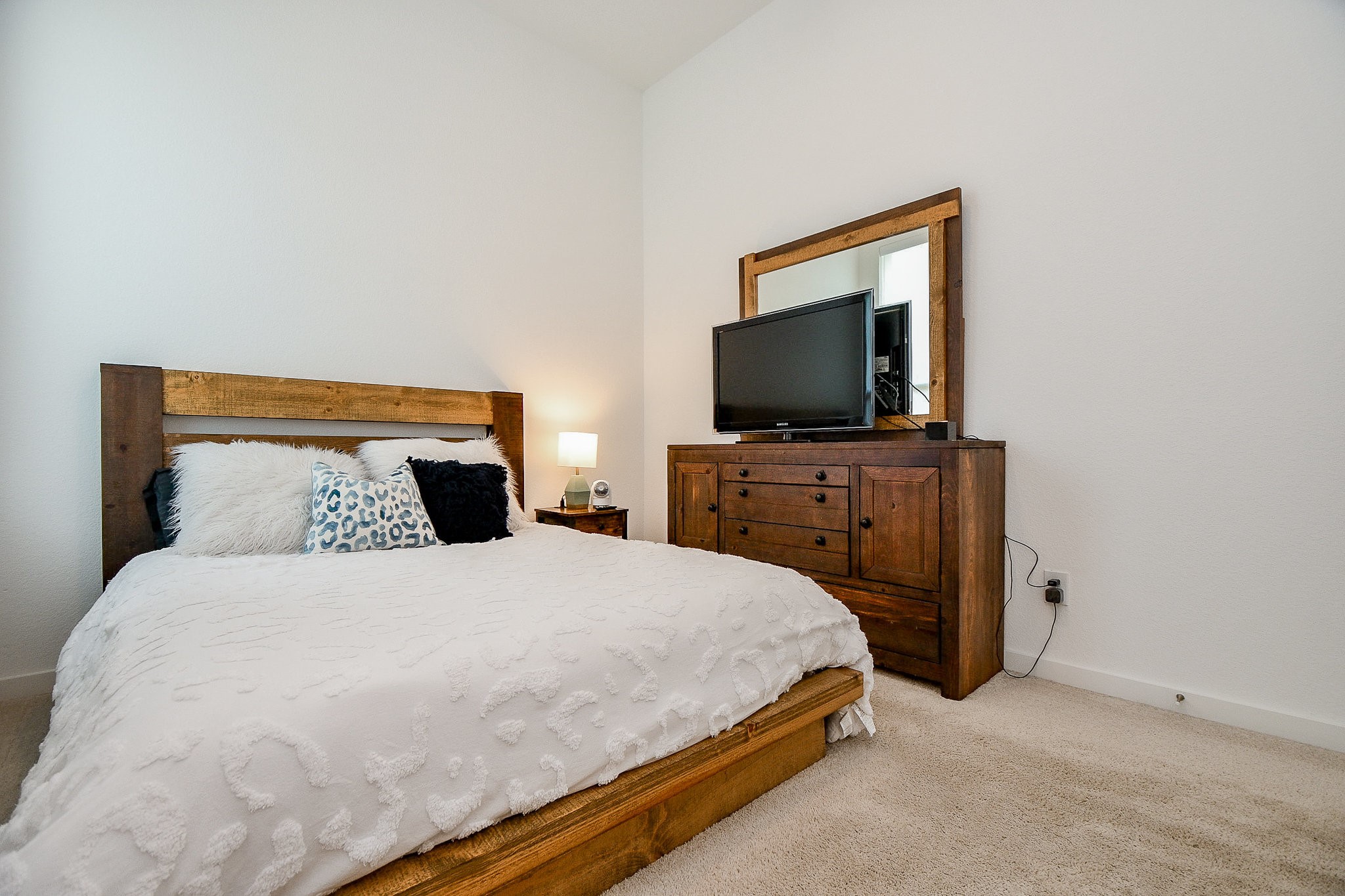5102 Pomegranate Path Manvel, TX 77578 - Photo 29 of 33 a bedroom with a bed and a flat screen tv